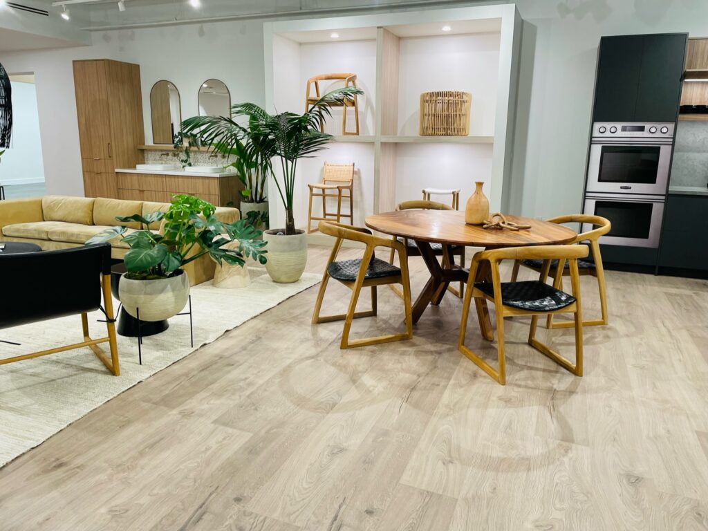 Laminate flooring with dinning table opening to the living room by Jordans Flooring in Victoria, BC - Vancouver, BC - South Surrey, BC - Richmond, BC - Red Deer, AB - Nanaimo, BC - Langley, BC - Victoria, BC - Kelowna, BC - Kamloops, BC - Edmonton, AB - Coquitlam, BC - Calgary, AB - Burnaby, BC - Abbotsford, BC