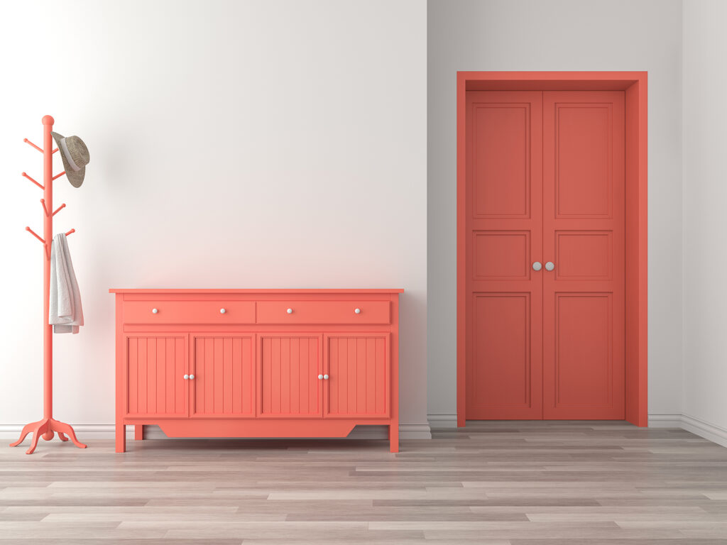 Laminate Flooring style in a small room with an orange dresser and door by Jordans Flooring in British Columbia, CA